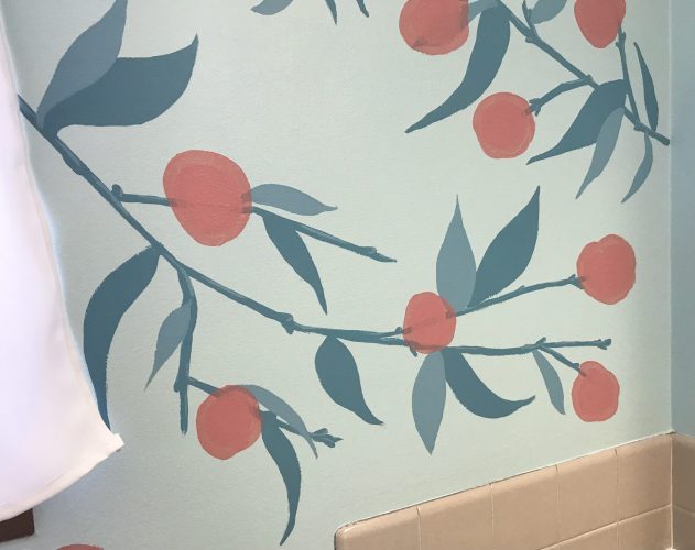 An abstract peach-themed mural for a bathroom.
